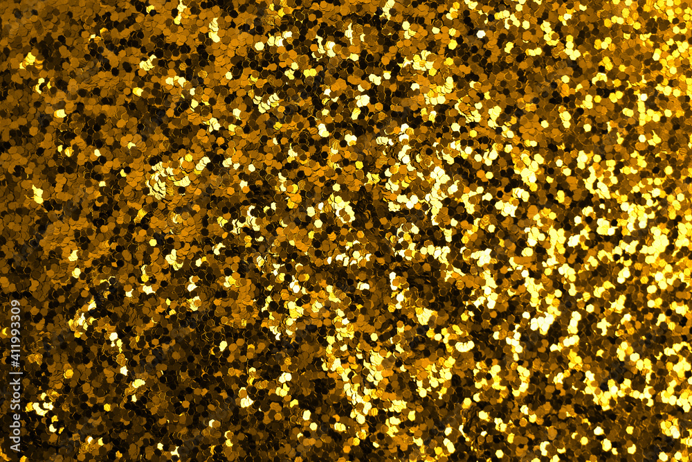 Gold defocused glitter. Bokeh light of gold glitters background. Gold defocused glitter. Bokeh light of gold glitters background.