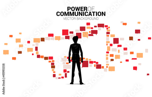 Silhouette of businessman standing with Big Megaphone from small bubble speech icon. Concept for power of comment and communication.