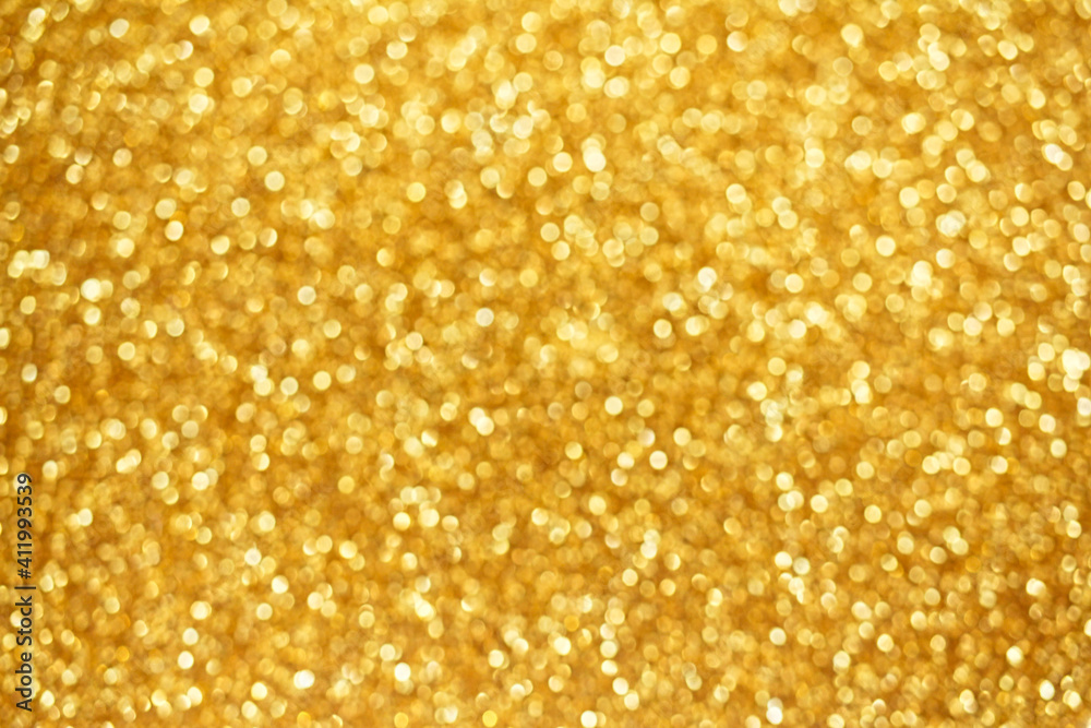 Gold defocused glitter. Bokeh light of gold glitters background. Gold defocused glitter. Bokeh light of gold glitters background.