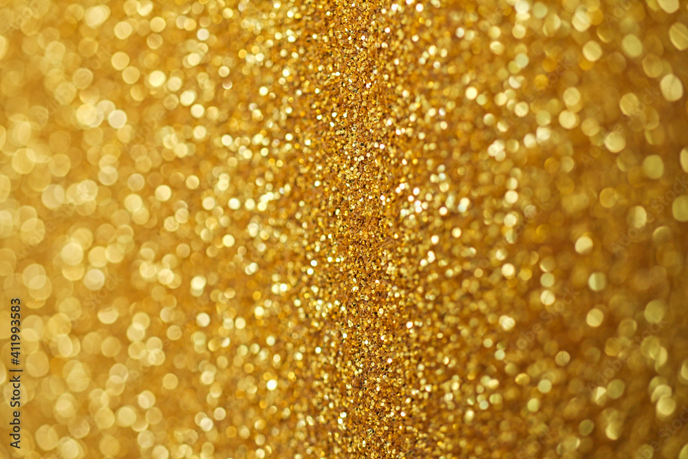 Gold defocused glitter. Bokeh light of gold glitters background. Gold defocused glitter. Bokeh light of gold glitters background.