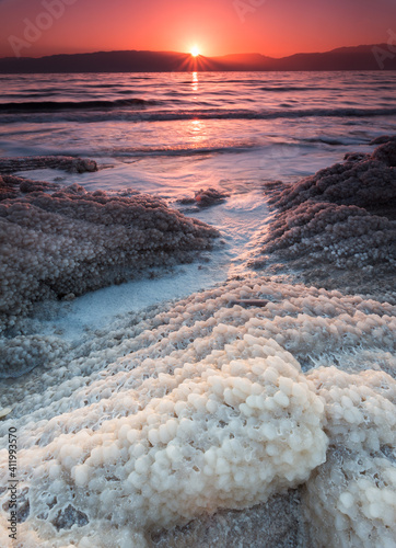 Sunrise over salt crystals in the dead sea, Israel