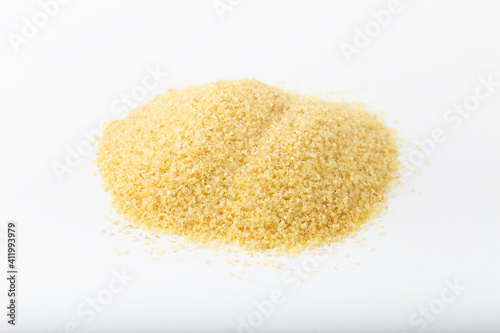 Heap of dry bulgur isolated on white background.