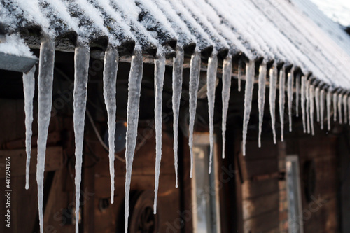 snow and icicles on the roof