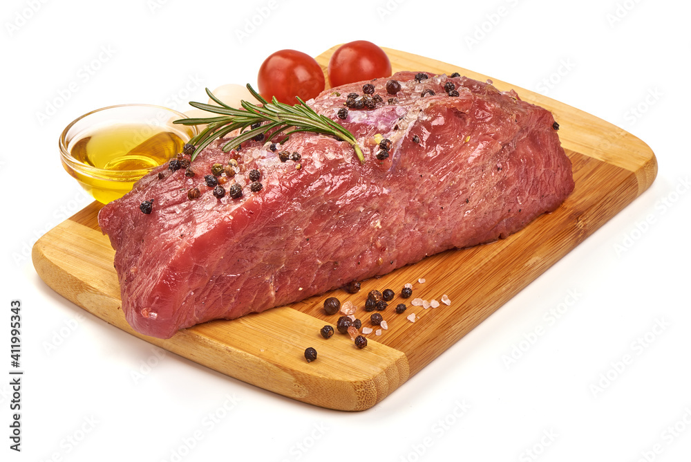 Uncooked beef meat with spices, isolated on white background Uncooked beef meat with spices, isolated on white background