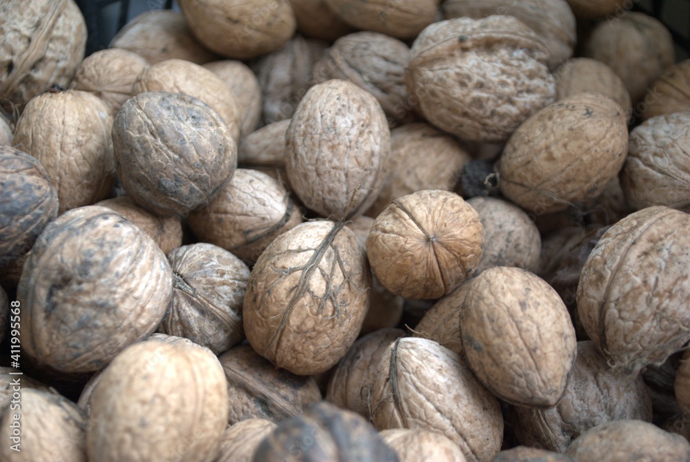 Top view of whole walnuts as background texture Top view of whole walnuts as background texture