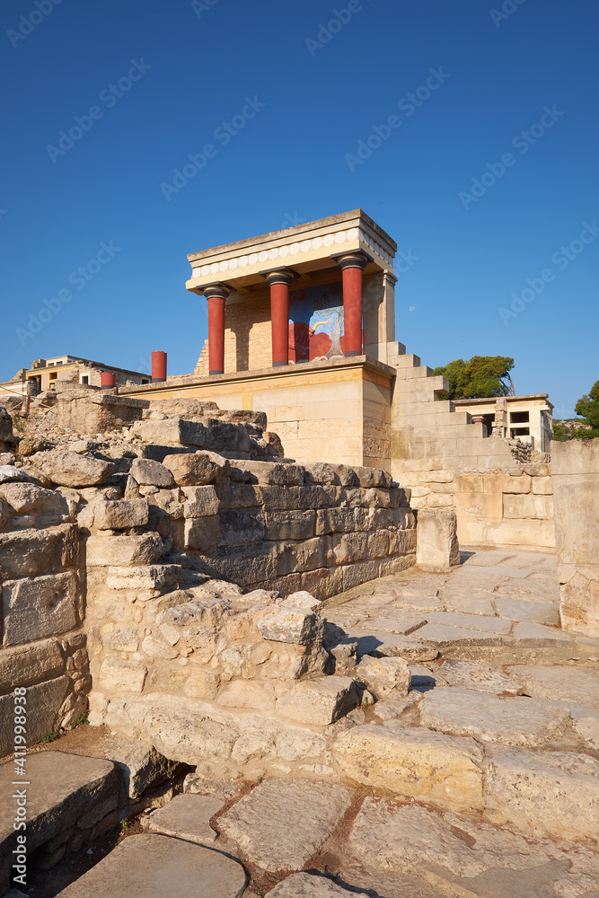 The North Portico in Knossos, Crete in Greece. Excavations of Knossos town is the biggest Bronze Age archaeological site on the island of Crete in Greece..