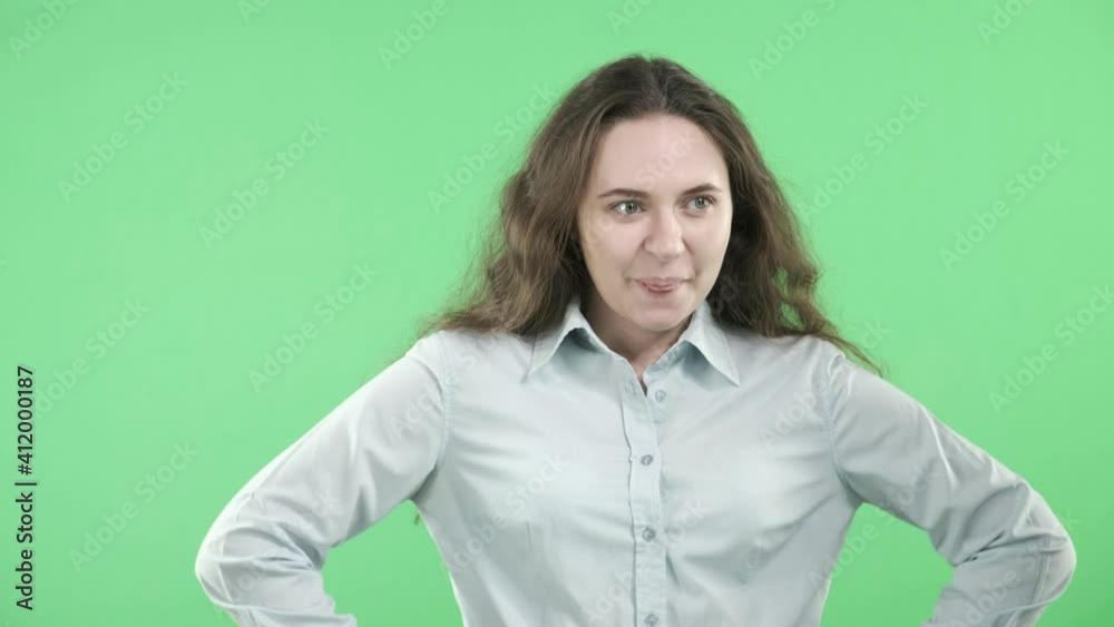 A young woman experiences a fit of unrestrained joy. The girl is happy in anticipation of something good. Joy, fun, emotions. The concept of arousal, pleasure, and positive attitude.