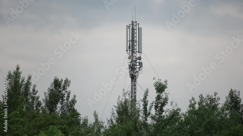 Cinematic shot: Telecommunication tower. Telecom tower antennas and satellite transmits the signals of cellular 5g 4g mobile signals to the consumers and smartphones. 4k. 25 fps