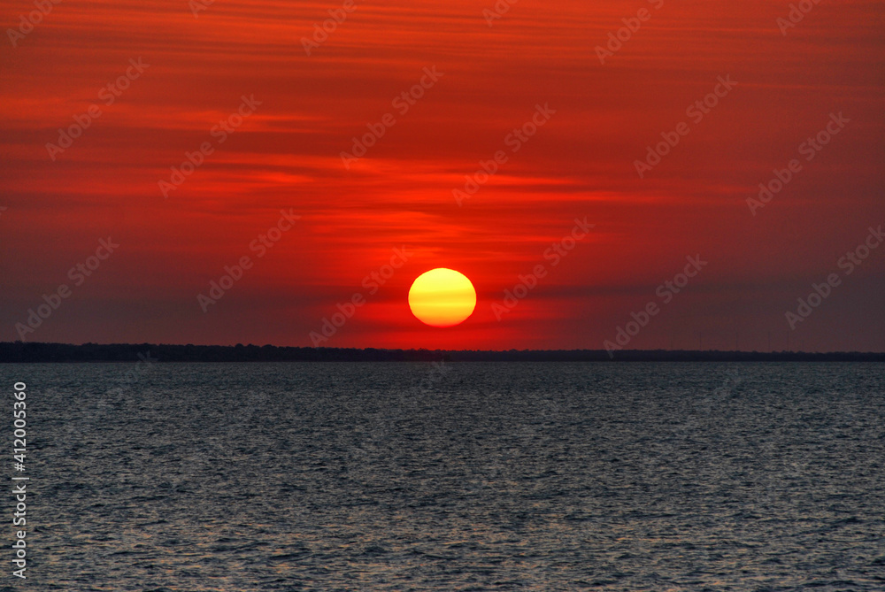 Colorful sunset through smoky skies in Fannie Bay, Darwin, Norther Territory, Australia