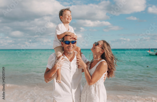 Happy family on the beach. Family vacation on the sea coast