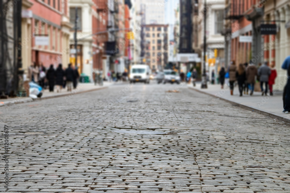 Greene Street is crowded with busy people in the SoHo neighborhood of Manhattan, New York City