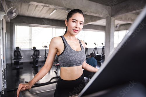Asian young woman exercising in the gym Enhance health For strength Exercise concept