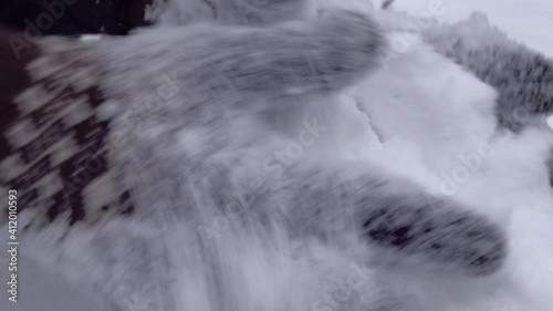 Close up of hands playing with powdery fluffy snow. Wearing woven gloves with nordic pattern. High quality audio recording of crunching sound of fresh snow. ASMR style video and audio.