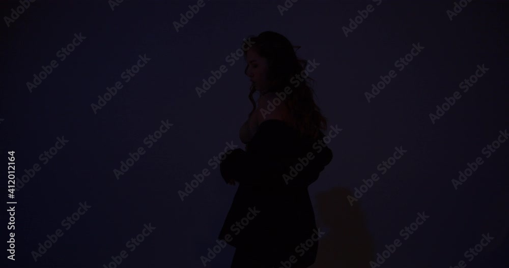 Blonde woman in a jacket is dancing in low lighting, professional performer, 4k Blonde woman in a jacket is dancing in low lighting, professional performer, 4k