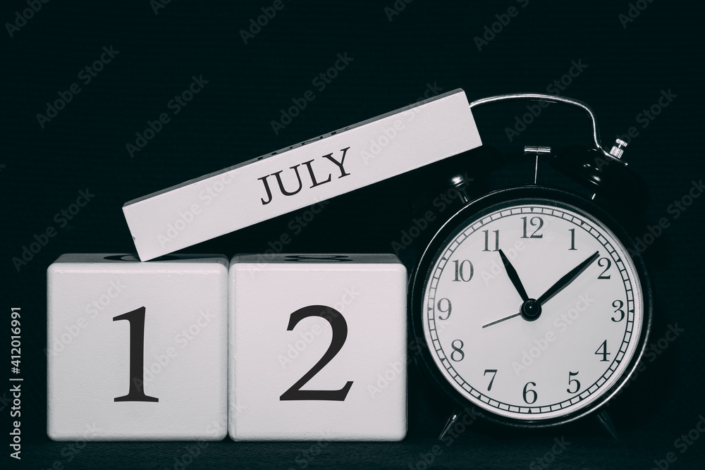 Important date and event on a black and white calendar. Cube date and month, day 12 July. Summer season. Important date and event on a black and white calendar. Cube date and month, day 12 July. Summer season.