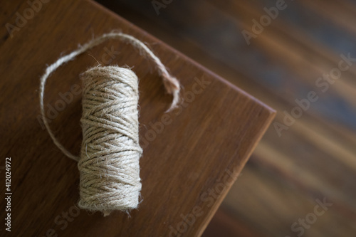 Roll of twine lit by natural light from nearby window