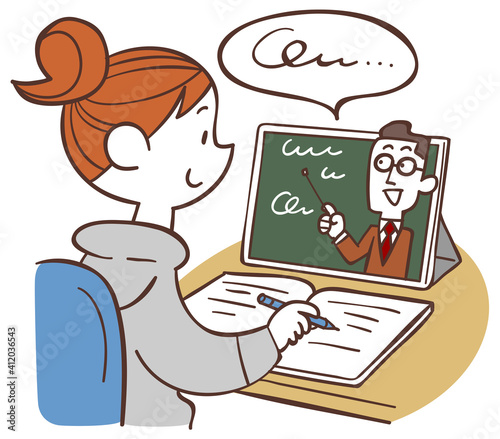 自宅でタブレットPCを使いオンライン授業を受ける女子生徒
