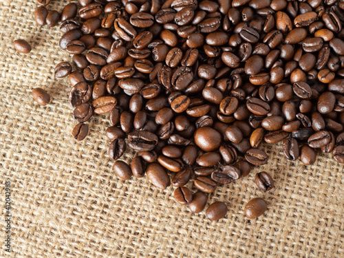 Coffee beans on linen texture background