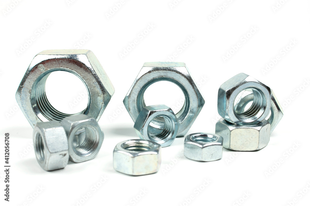 large metal nuts on a white background close up large metal nuts on a white background close up