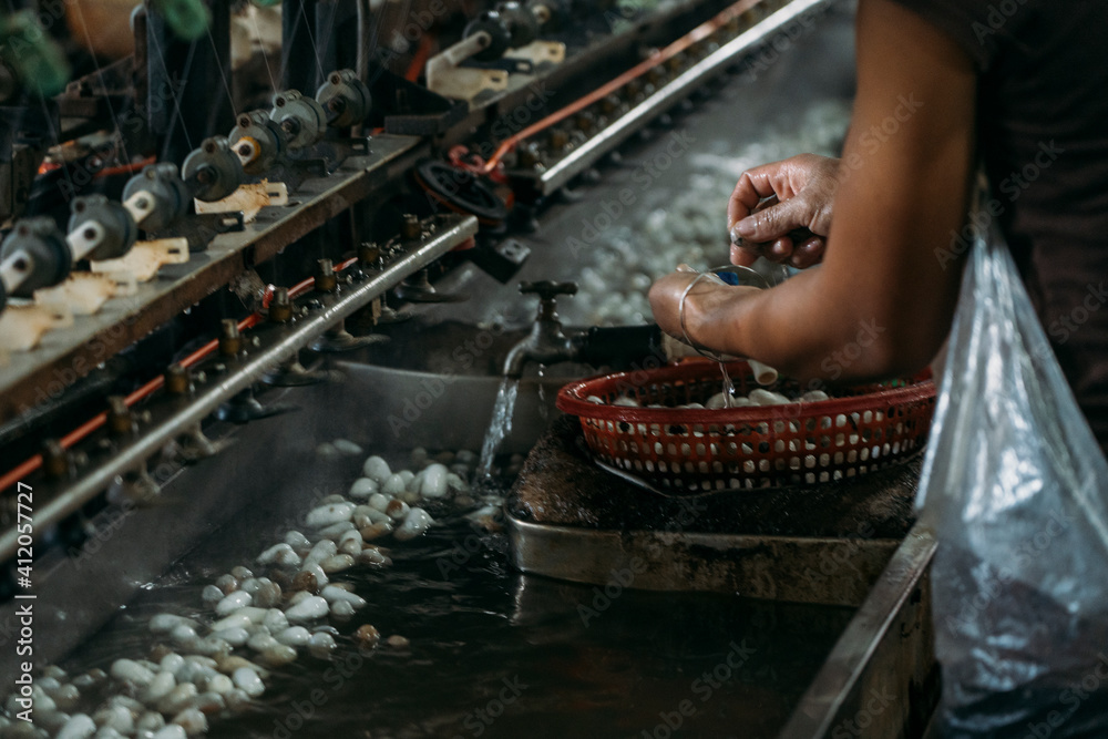 Close-up of silk worm factory processing with water sinks.