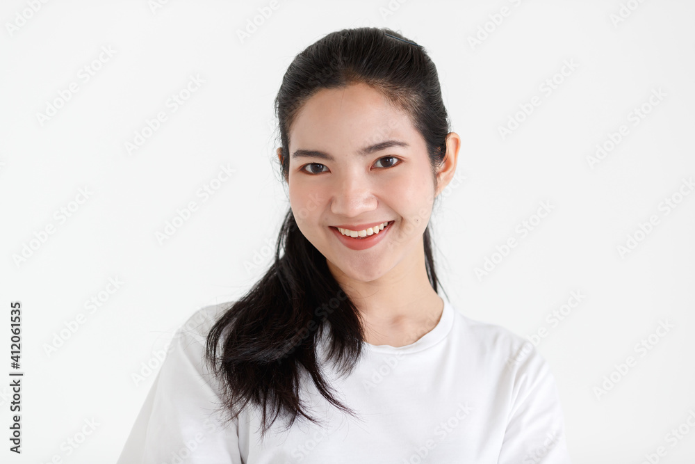 Portrait of a young teen Asian woman with a black long hair on white background Portrait of a young teen Asian woman with a black long hair on white background