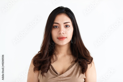 Portrait of a young teen Asian woman with black long hair on white background © Bangkok Click Studio
