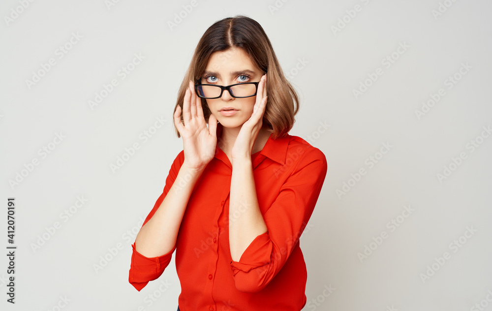 Woman in red shirt and glasses business finance director of firm manager Woman in red shirt and glasses business finance director of firm manager