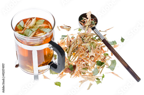 Glass with herbal tea from dried plants, alternative medicine photo