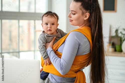 Young mother with little ba...