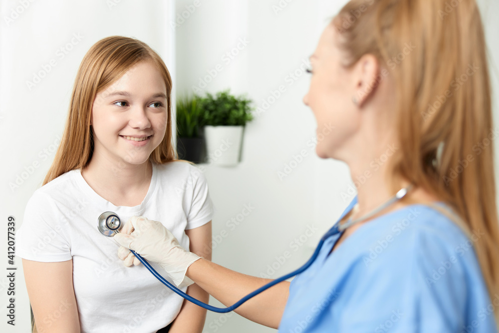 woman doctor examining a child stethoscope hospital woman doctor examining a child stethoscope hospital
