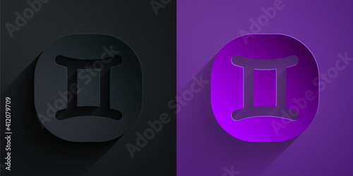 Paper cut Gemini zodiac sign icon isolated on black on purple background. Astrological horoscope collection. Paper art style. Vector.