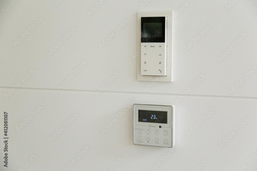 white Wall display shows air temperature inside the room. temperature and heating.