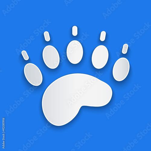 Paper cut Bear paw footprint icon isolated on blue background. Paper art style. Vector.