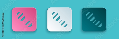 Paper cut Human footprints shoes icon isolated on blue background. Shoes sole. Paper art style. Vector.