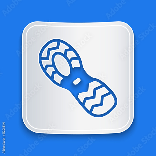 Paper cut Human footprints shoes icon isolated on blue background. Shoes sole. Paper art style. Vector.