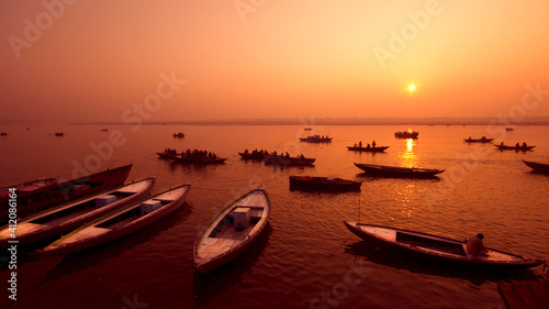 Pilgrims taking a boat ride on a beautiful winter morning in the sacred river of Ganges in Varanasi, holy city for Hindus.  © Kris Hariharan