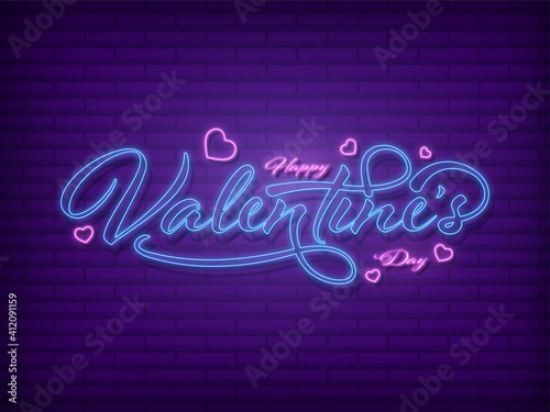 Neon Effect Happy Valentine's Day Font With Hearts Decorated On Purple Brick Wall Background.