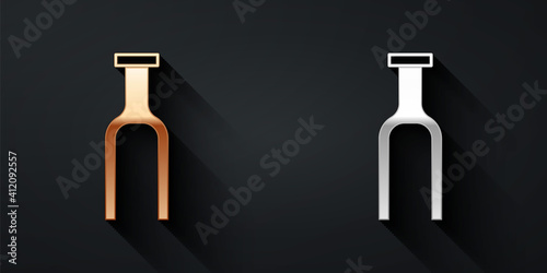 Gold and silver Bicycle suspension fork icon isolated on black background. Sport transportation spare part steering wheel. Long shadow style. Vector.