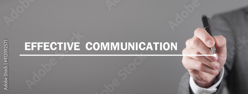 Man writes Effective Communication text in screen.