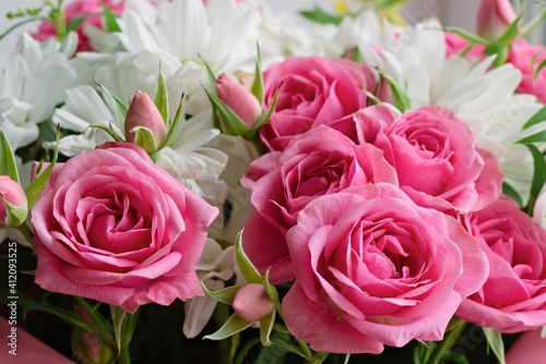 Bouquet of pink roses and white chrysanthemums. Flower background