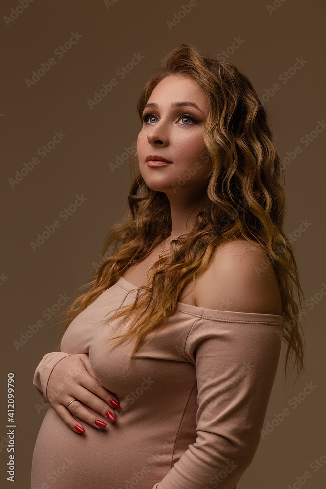 Pregnant girl on a light background Pregnant girl on a light background