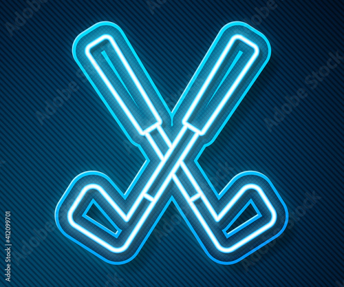Glowing neon line Crossed golf club icon isolated on blue background. Vector.