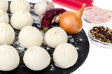 Frozen dumplings with filling for cooking. Photo