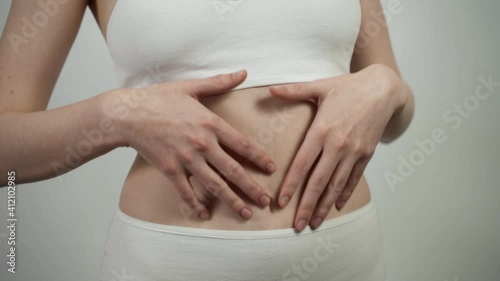 Wallpaper Mural Close up of unrecognizable Caucasian woman checking her belly skin condition. Torontodigital.ca