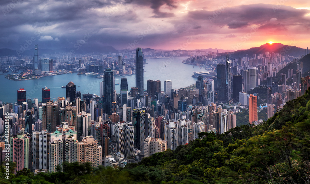 Hong Kong skyline at dramatic sunrise, Victoria harbour