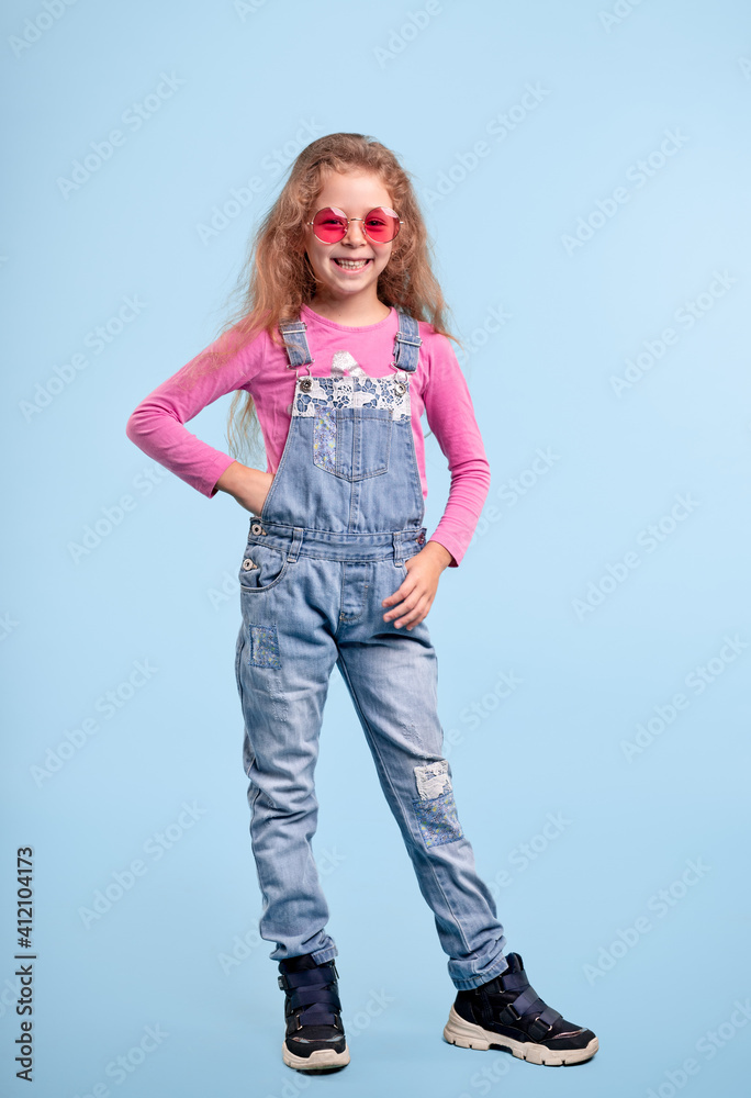 Fashionable girl in denim overall Fashionable girl in denim overall