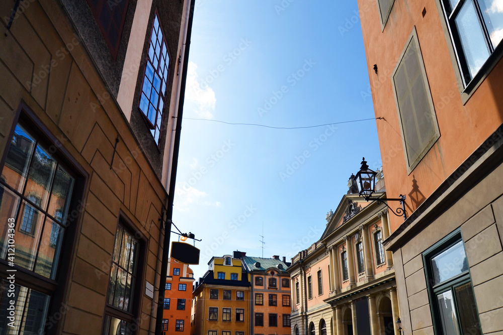 Fototapeta premium Narrow street with colorful buildings in the Old Town (Gamla Stan), Stockholm center, Sweden