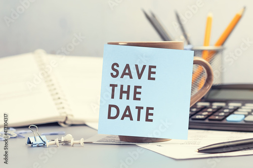 Save the date - concept of text on sticky note