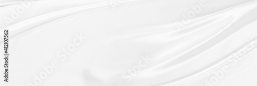 White gray satin texture that is white silver fabric silk panorama background with beautiful soft blur pattern natural. photo