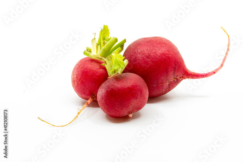 Close up group three of red beetroots on white background, small beetroots, low angle view, bright colors.